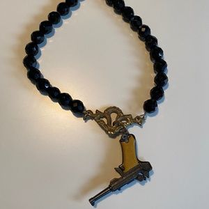 Beaded shiny toy gun necklace